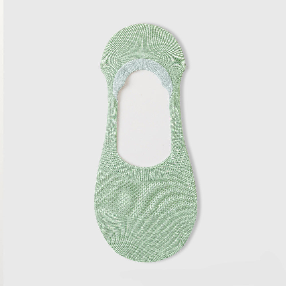 Mint green no-show sock liner featuring knit texture and elastic comfort band on white background