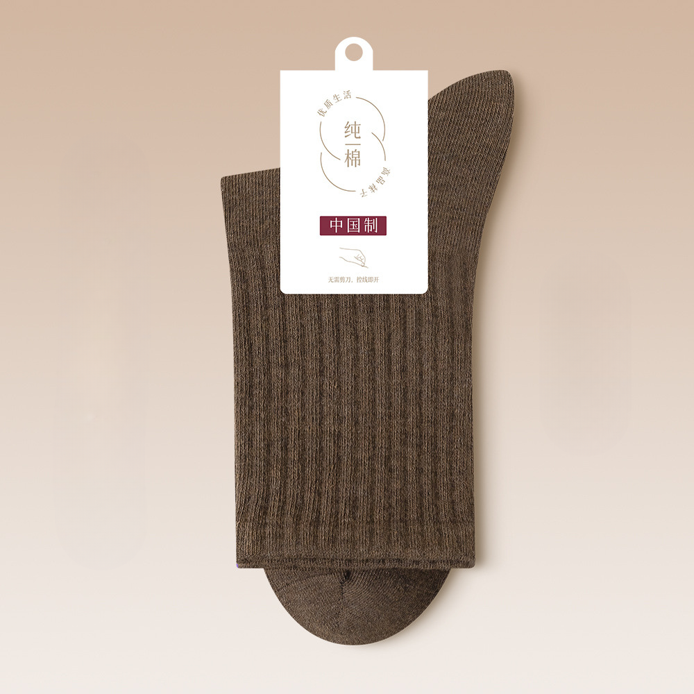 Dark brown ribbed cotton sock with brand tag showing quality certification