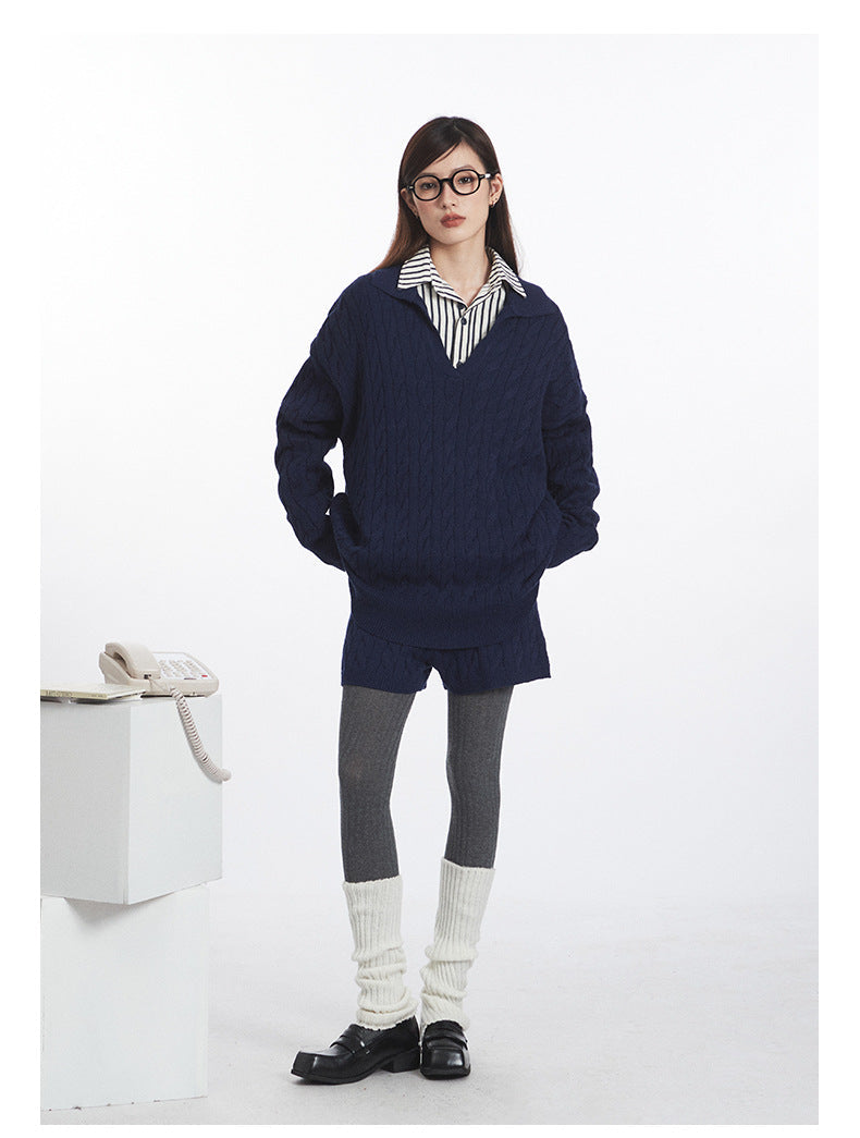 Full body shot of navy knit set showing coordinated cable pattern on both pieces