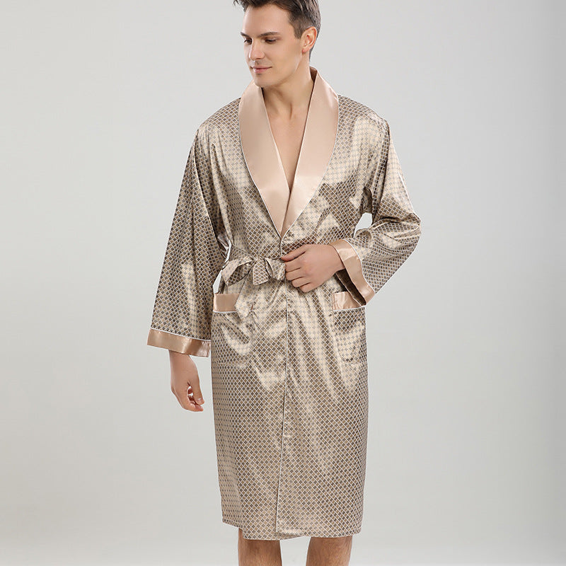 Man in beige diamond pattern silk robe with matching belt. Close-up shows detailed stitching and champagne-colored satin collar against studio lighting