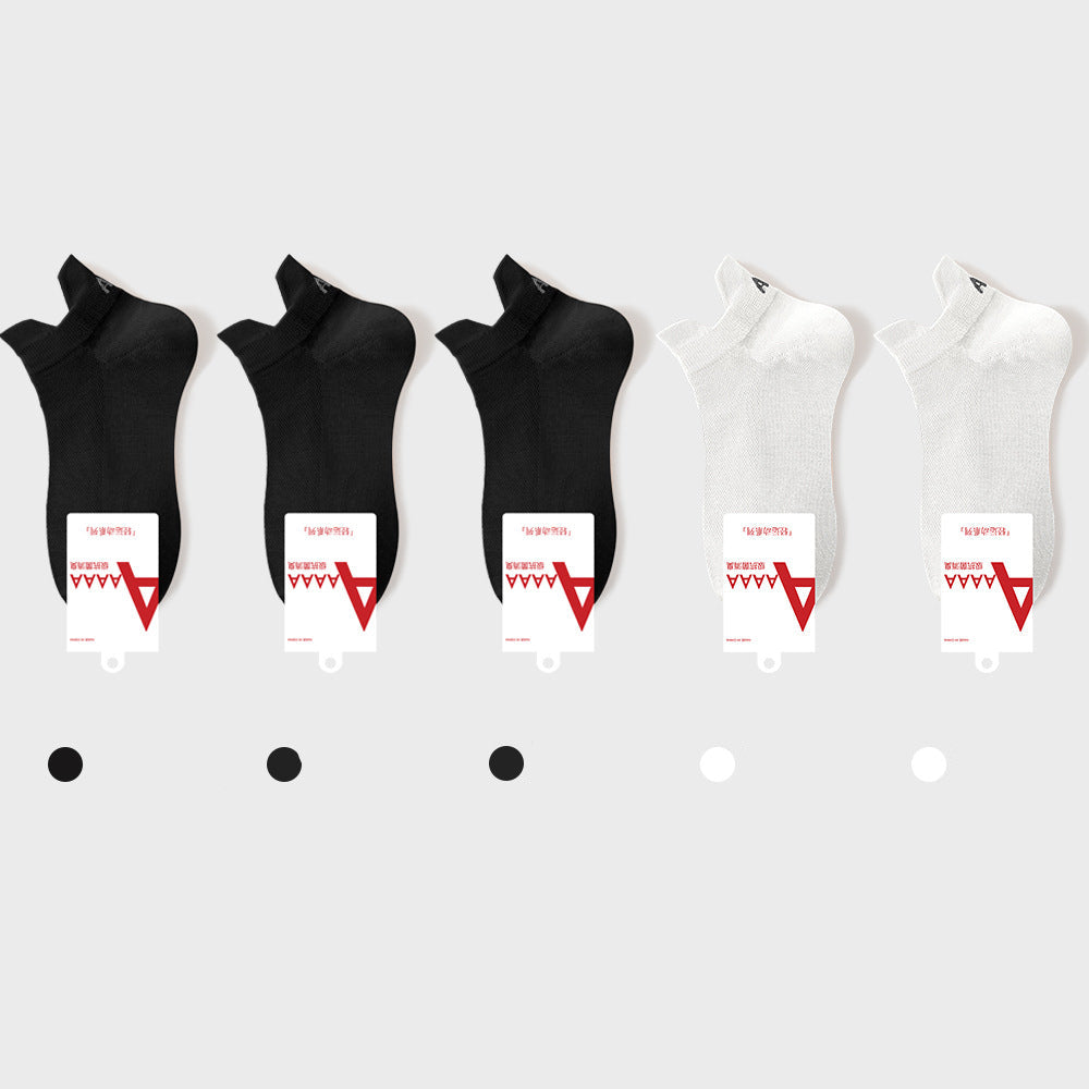 Black/White antibacterial ankle socks with brand label and quality certification tags, retail presentation
