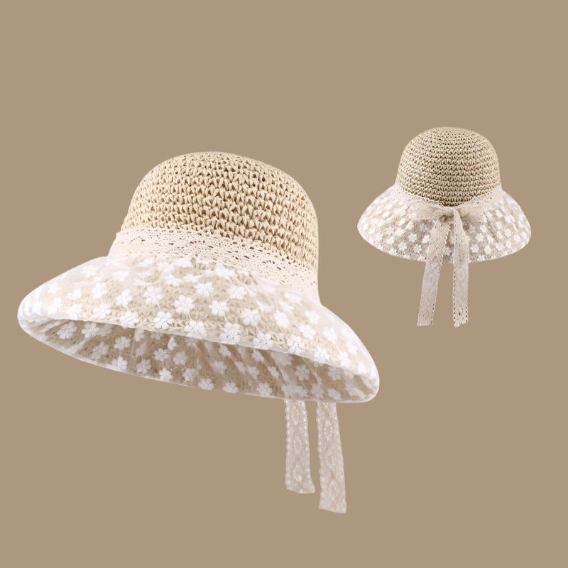 A vanilla woven sun hat with a floral lace-trimmed brim and a ribbon bow at the back, displayed in two angles for a closer look at the design.
