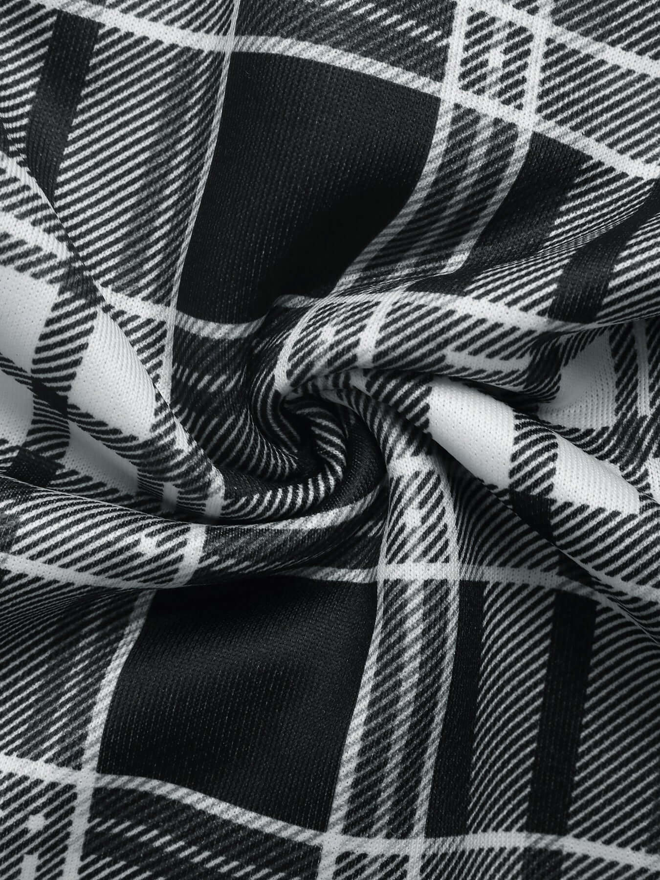 Soft and lightweight plaid fabric with a slight texture, twisted to show elasticity and smoothness.