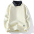 Cream waffle-knit sweater with black collar accent