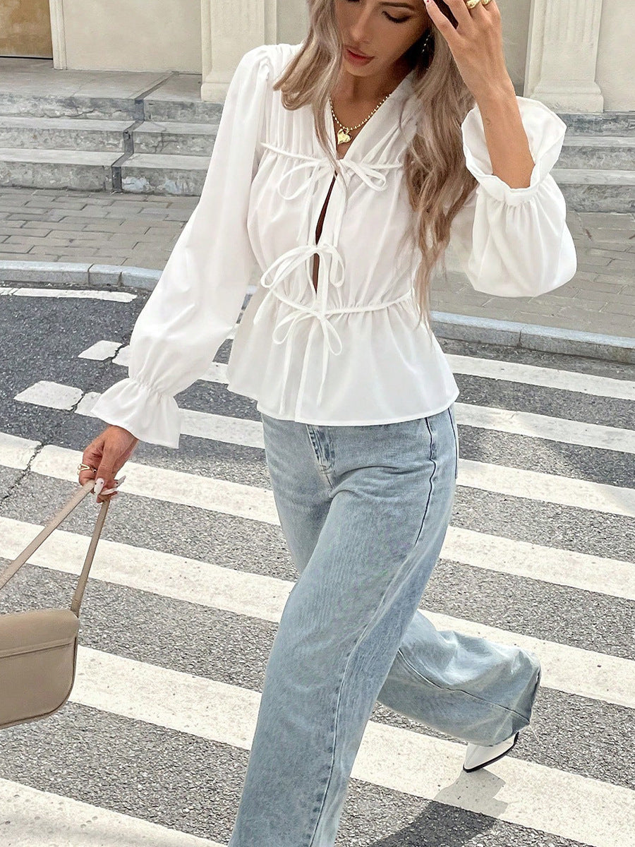 Chic white puff sleeve blouse styled with jeans casual look