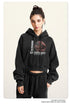 Black cropped hoodie with graphic print, model front view