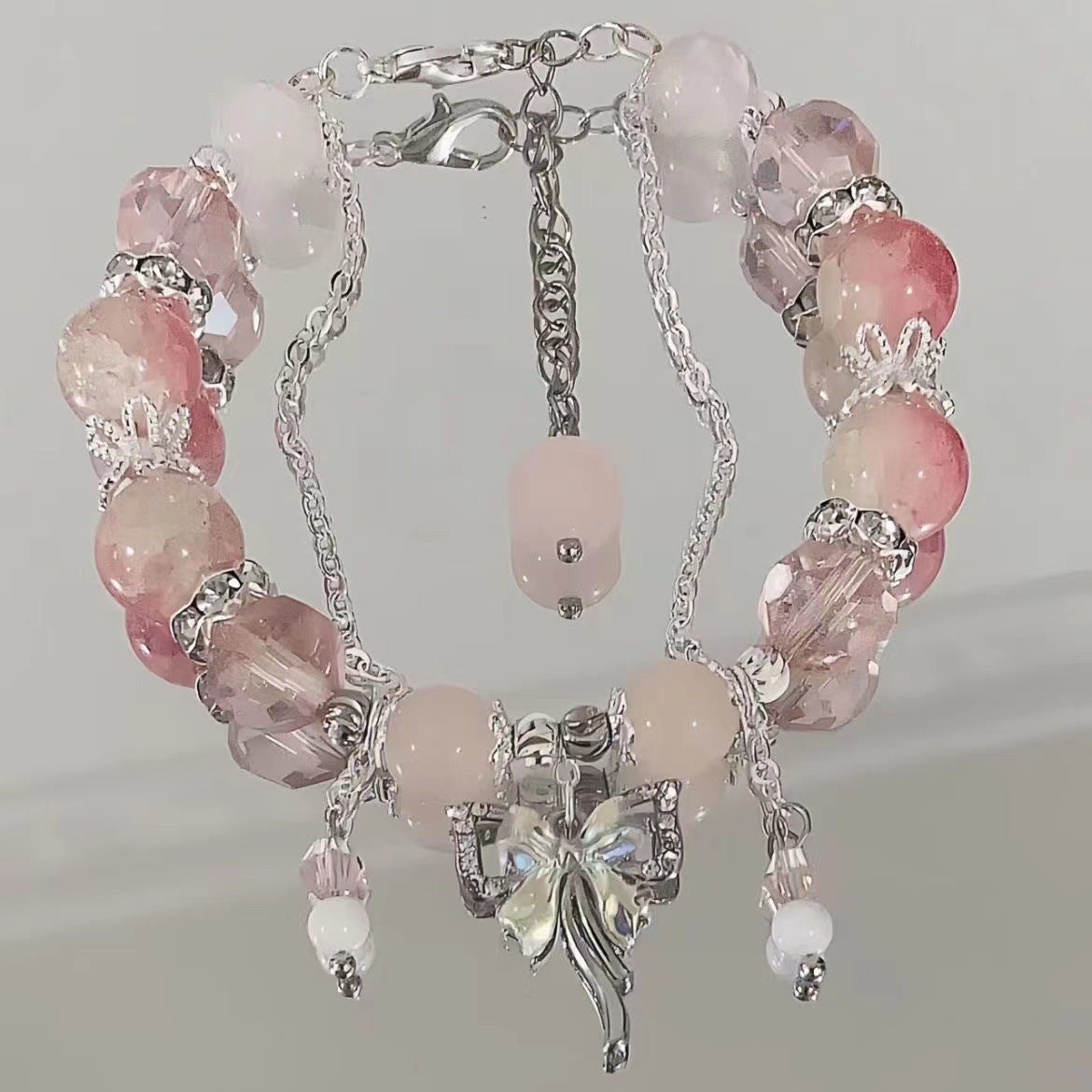Pink crystal bracelet with silver fairy pendant and matching dangling beads with adjustable chain