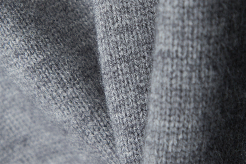 Extreme close-up of heather grey knit fabric showing stitch pattern.