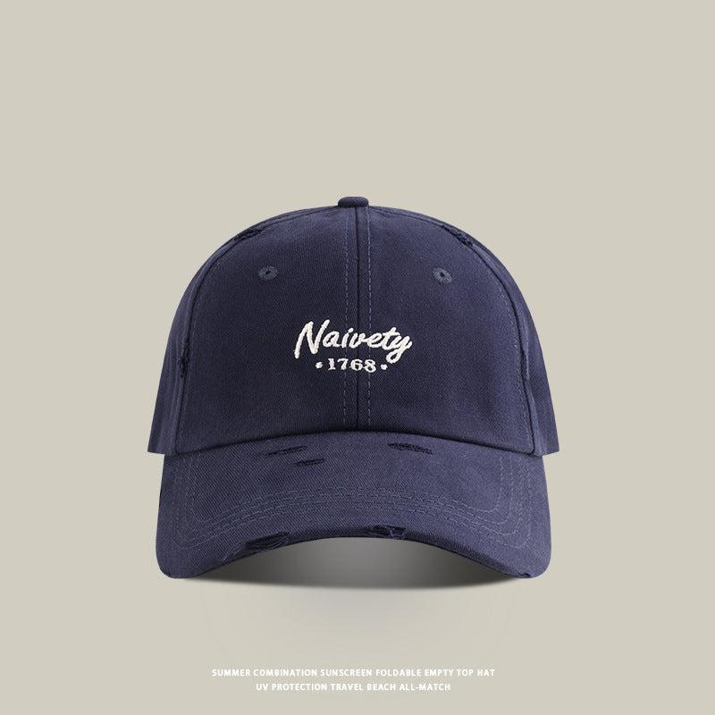 Navy blue baseball cap with white 'Naivety 1768' embroidered logo