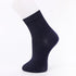 Navy blue ankle sock displayed on a mannequin foot