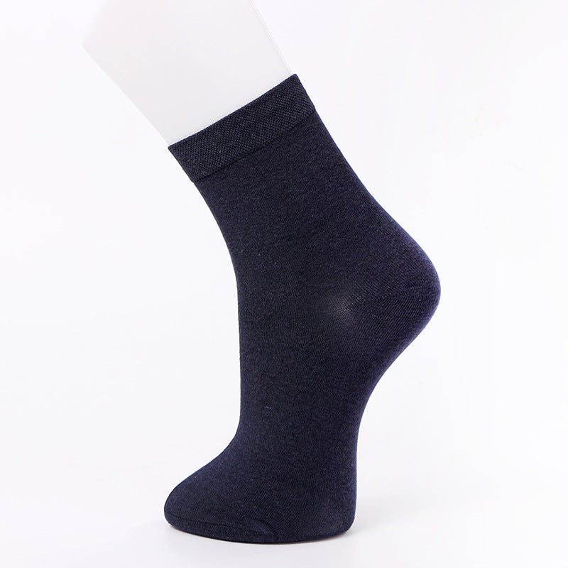 Navy blue ankle sock displayed on a mannequin foot