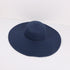 Navy blue wide-brimmed sun hat with a woven texture, placed on a white background.