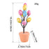 Easter egg tree with floral and polka dot eggs arranged in a terracotta pot, bringing a cheerful spring vibe to any space.