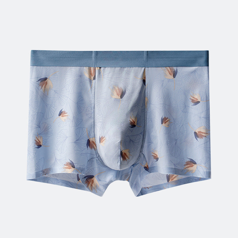 Men's boxer briefs in powder blue with delicate floral pattern in beige and navy, featuring blue elastic waistband