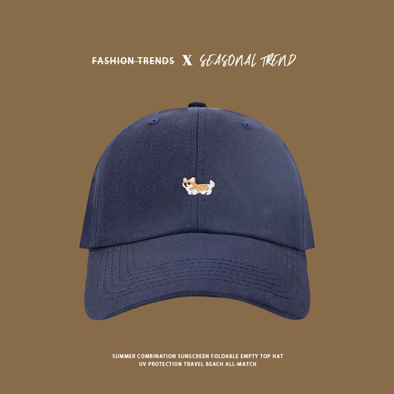 Navy blue baseball cap featuring corgi embroidery detail, summer beach style