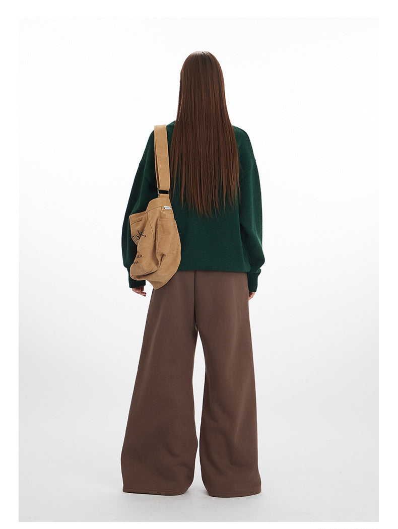 Back view of green sweater and brown wide-leg pants ensemble