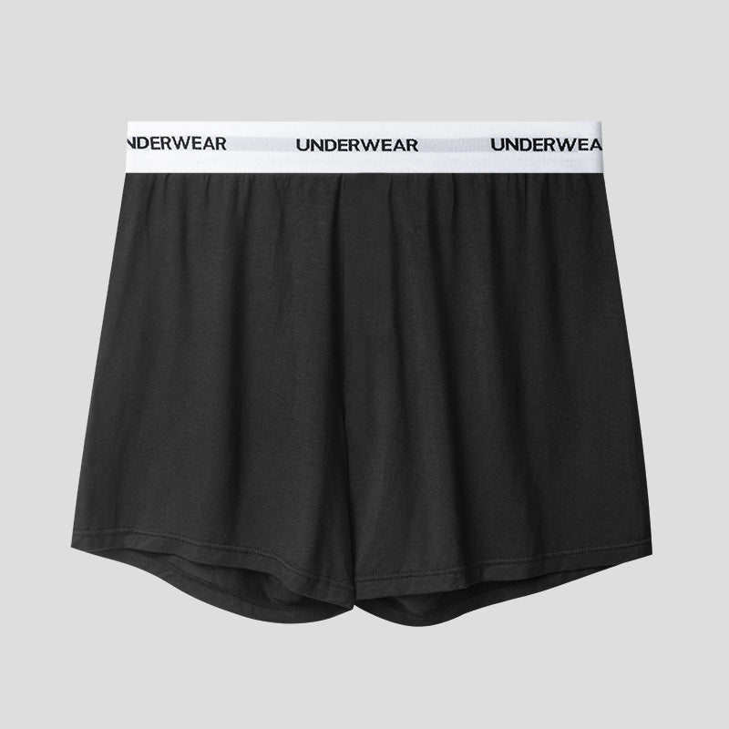 A black boxer short with white elastic waistband displaying 'UNDERWEAR' text, shown against light gray background