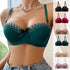 A woman wearing a teal green push-up bra with lace trim and bow detail, paired with denim, photographed near window