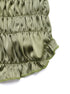 Close-up of side seam and ruched texture