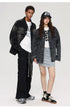 A male model in a gradient black denim jacket and cargo pants stands beside a female model in an oversized denim jacket, a mini skirt, and a graphic cap