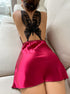 Deep red satin mini dress with black lace butterfly back detail