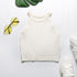 White ribbed halter crop top flatlay with sneakers and yellow-tinted sunglasses