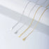 Silver and gold chain options with extension clasps displayed on white surface, showing different lengths and attachment mechanisms