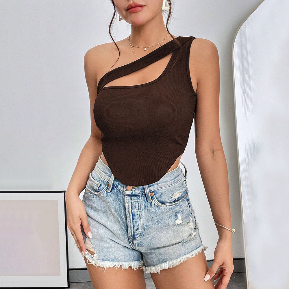 Brown one-shoulder ribbed top with skin-revealing cutout, worn with light denim shorts