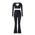 Black V-neck long sleeve workout two-piece with cutout detail and flared leggings on white background