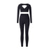 Black V-neck workout set with long sleeve crop top and high-waisted fitted leggings on white background