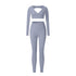 Blue-gray workout set with slim-fit leggings and V-neck long sleeve crop top showing back cutout