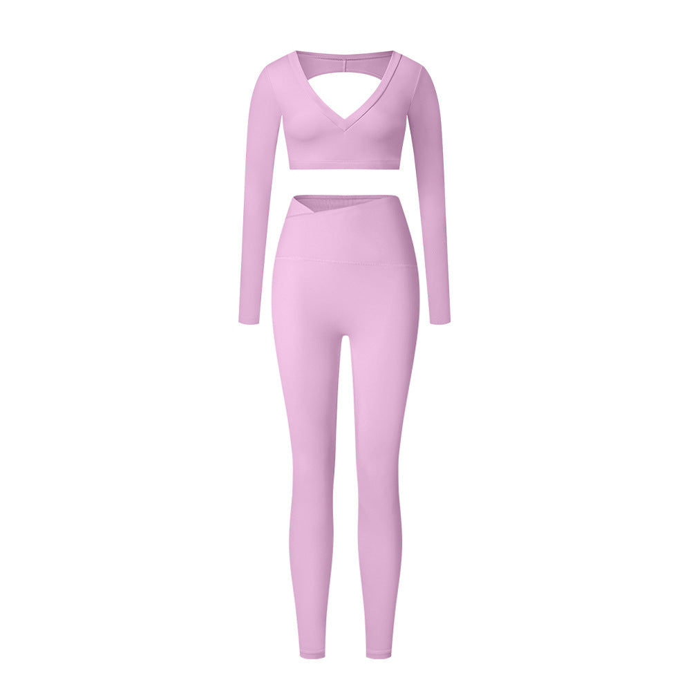 Lilac workout set with V-neck long sleeve crop top and high-waisted leggings on white background