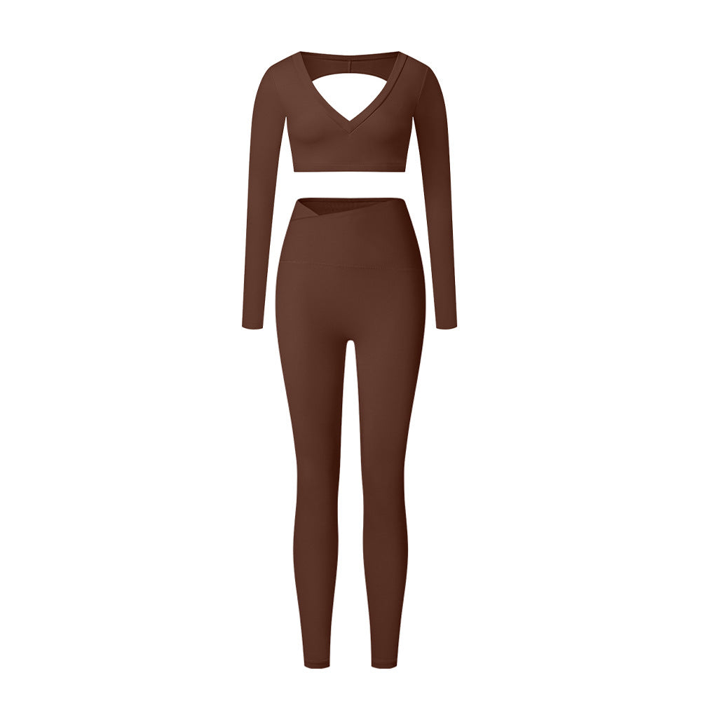 Brown long sleeve V-neck workout set with crop top and high-waisted leggings on white background