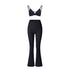 Black strappy workout set with triangle bralette top and high-waisted flared leggings on white background