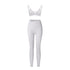 White strappy triangle bralette and high-waisted leggings set with asymmetrical waistband on white background