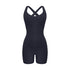 Black cross-back bodysuit with sweetheart neckline and bike short length displayed against white background