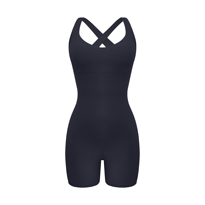 Black cross-back bodysuit with sweetheart neckline and bike short length displayed against white background