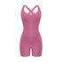 Mauve pink cross-back bodysuit with sweetheart neckline and bike short length displayed against white background