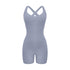 Light gray cross-back bodysuit with sweetheart neckline and bike short length displayed against white background