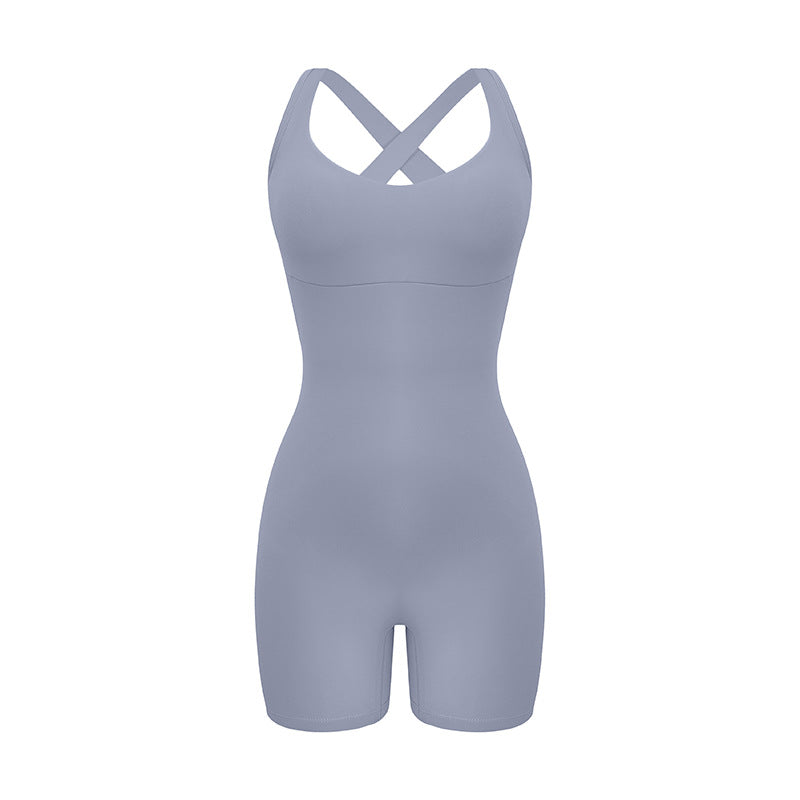 Light gray cross-back bodysuit with sweetheart neckline and bike short length displayed against white background