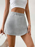 Front detail of grey modal jersey skort with curved hem and elastic waistband