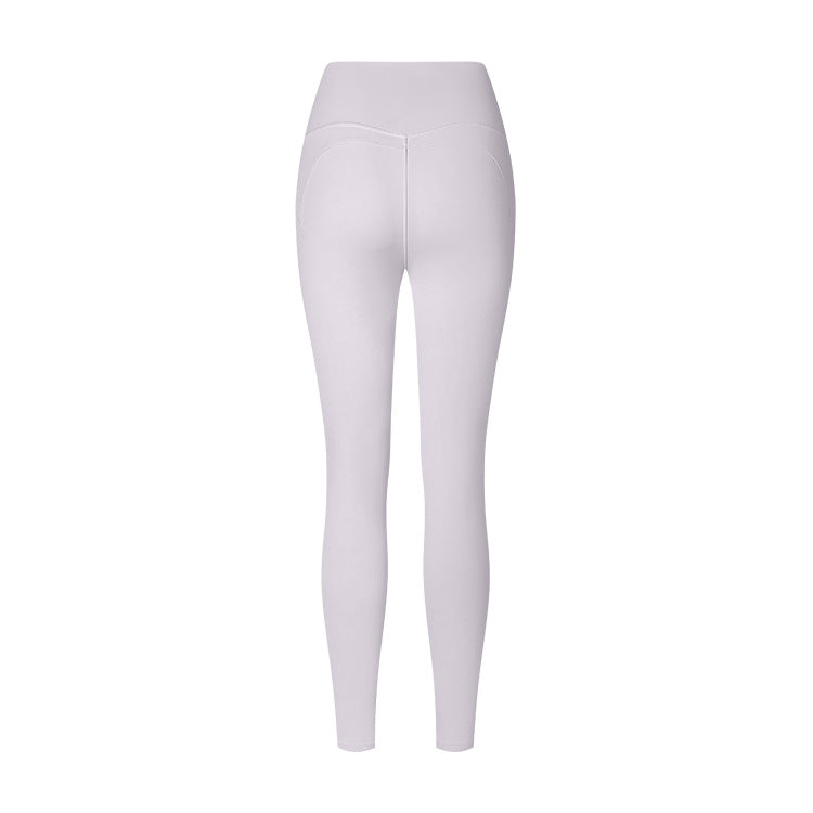 White high-waisted athletic leggings shown from behind with curved back seams, displayed on a plain white background