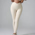 A model wearing cream ribbed seamless leggings with diagonal seam detail against gray background