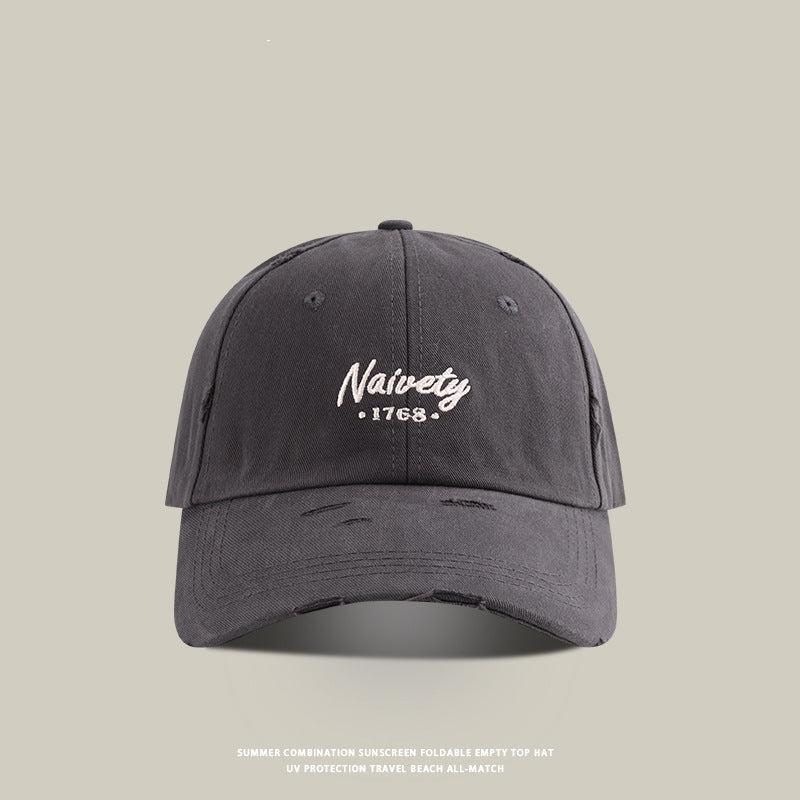 Gray baseball cap with white 'Naivety 1768' embroidered logo