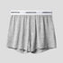 Heather gray boxer short with white elastic waistband displaying 'UNDERWEAR' text against light gray background
