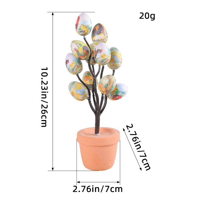 Vintage-style Easter egg tree with farmhouse prints in a terracotta pot, featuring scenic countryside egg designs.
