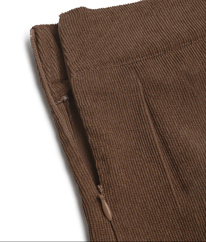 Side zipper detail of the brown pleated skort, showing its hidden closure.