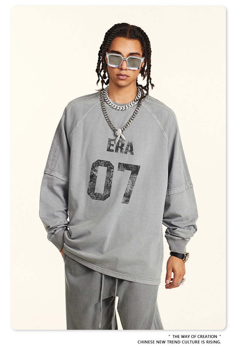 Close-up of gray 'ERA 07' sweatshirt showing distressed logo detail