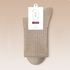 Light beige ribbed sock showcasing natural cotton texture and branded tag