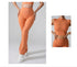 Side view and back view of coral workout set featuring high-waisted flared pants and matching crop top on gray background
